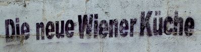 Graffiti mit dem Wortlaut "Die neue Wiener Küche". Schlagworte: Beschriftung, Schild